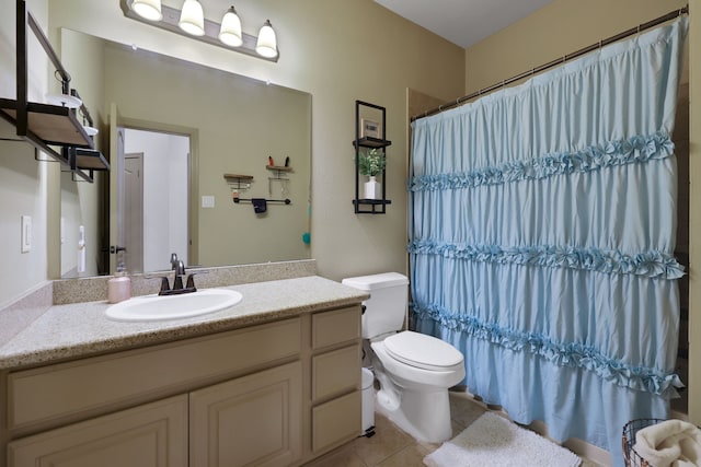 full bath featuring toilet, tile patterned flooring, a shower with shower curtain, and vanity