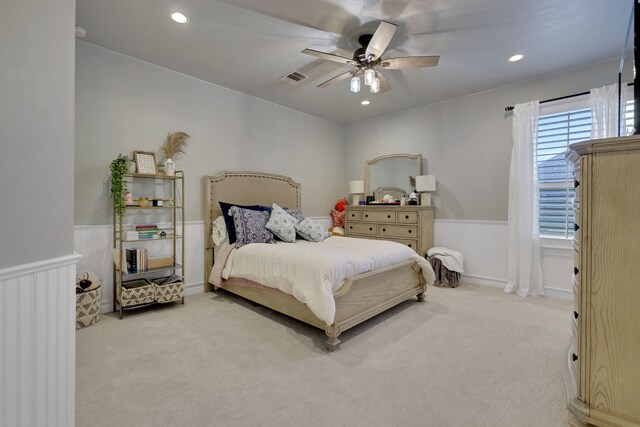 17715 Lakeside Haven Dr, Cypress, TX 77433 - carpeted bedroom with wainscoting, a ceiling fan, and recessed lighting