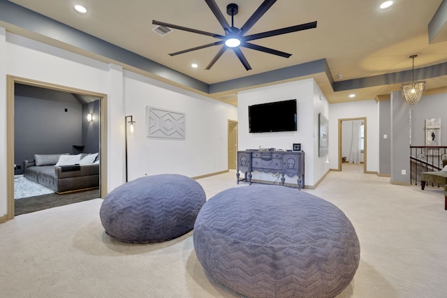 sitting room with light carpet and recessed lighting