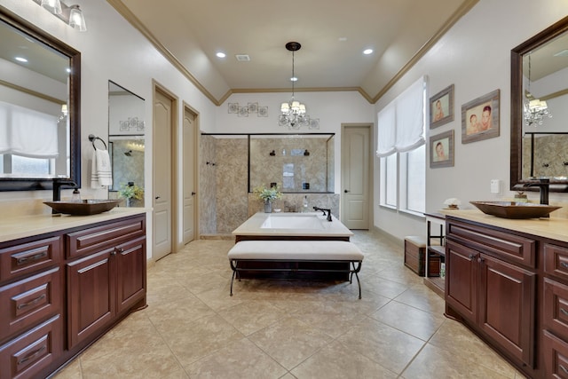 17715 Lakeside Haven Dr, Cypress, TX 77433 - full bathroom with a chandelier, crown molding, tiled shower, two vanities, and tile patterned floors