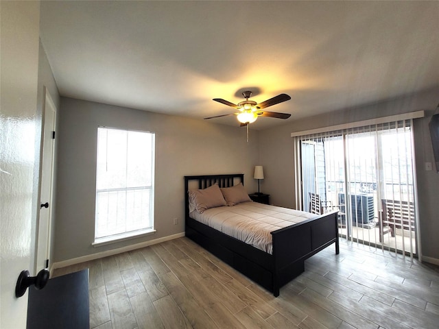 bedroom featuring ceiling fan, hardwood / wood-style floors, and access to outside