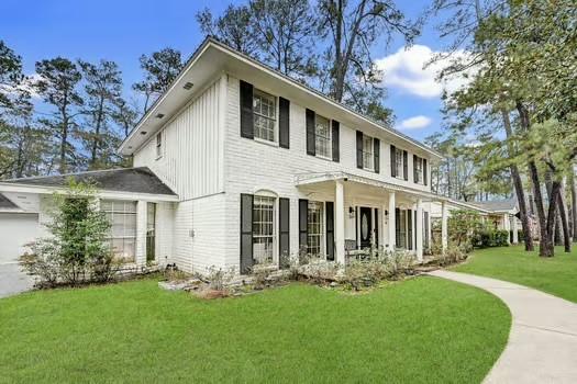 exterior space with a yard and covered porch