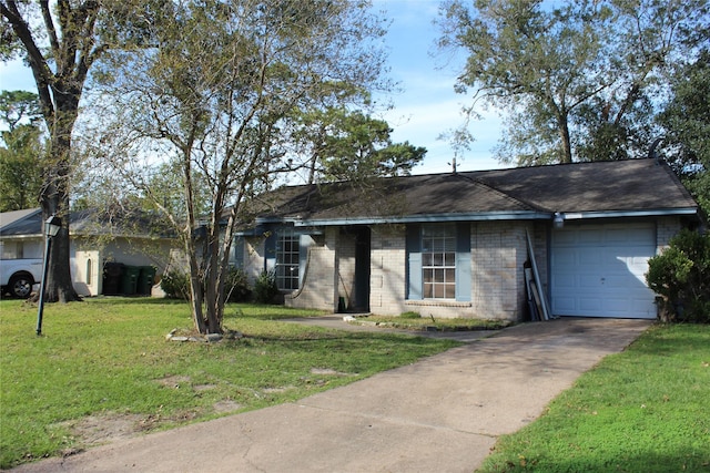 single story home with a garage and a front lawn