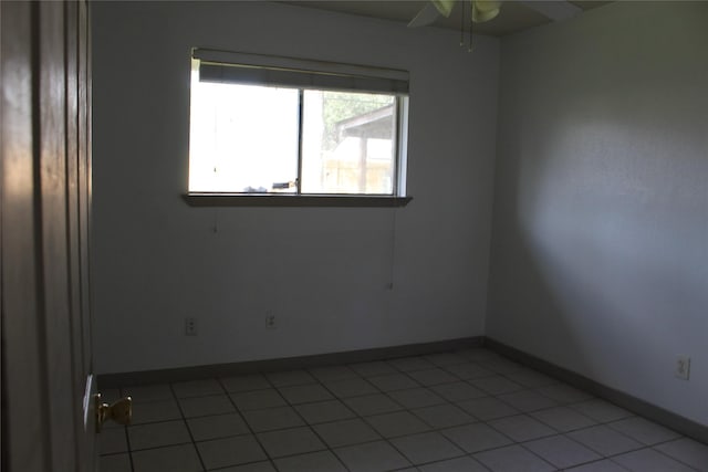 unfurnished room featuring ceiling fan and light tile patterned flooring