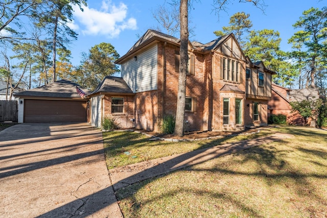 english style home with a front lawn