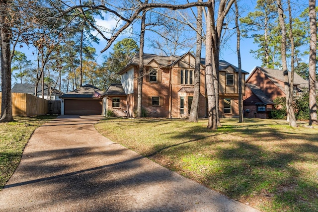 view of front of home featuring a garage and a front yard