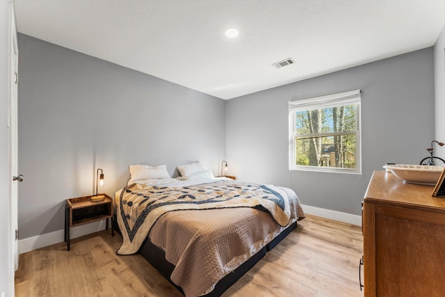 bedroom with light wood-type flooring