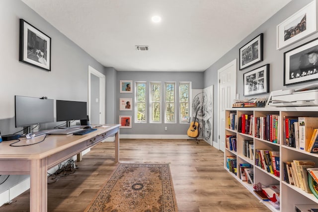 office area with light wood-type flooring