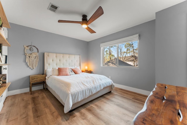 bedroom featuring hardwood / wood-style flooring and ceiling fan