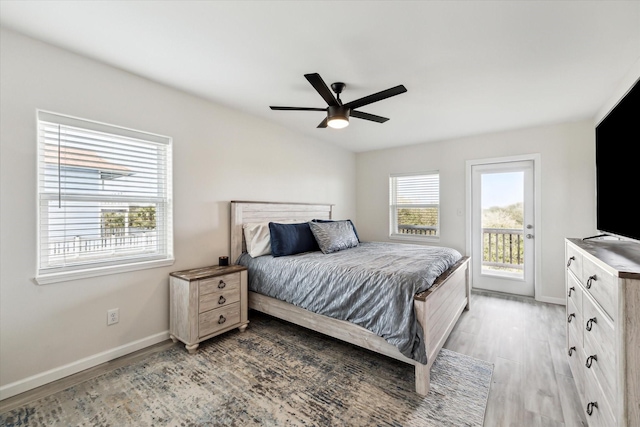 bedroom with access to exterior, ceiling fan, and light wood-type flooring