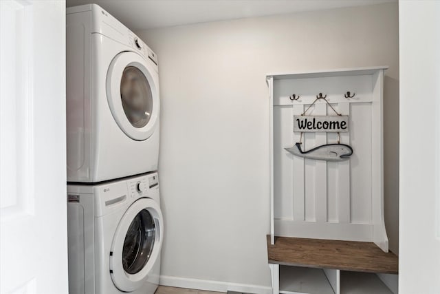 laundry area with stacked washer and clothes dryer