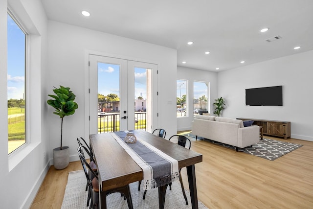 dining space featuring recessed lighting, light wood-style flooring, french doors, and visible vents