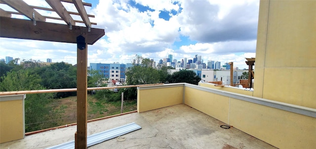 balcony featuring a pergola