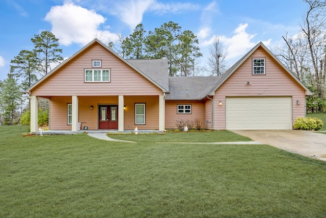 view of front of home featuring french doors, a garage, covered porch, and a front lawn