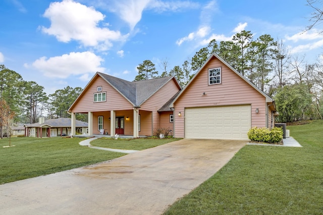 view of front of house featuring a garage, a front yard, and covered porch