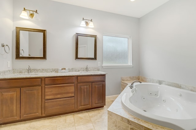 bathroom featuring vanity and tiled bath