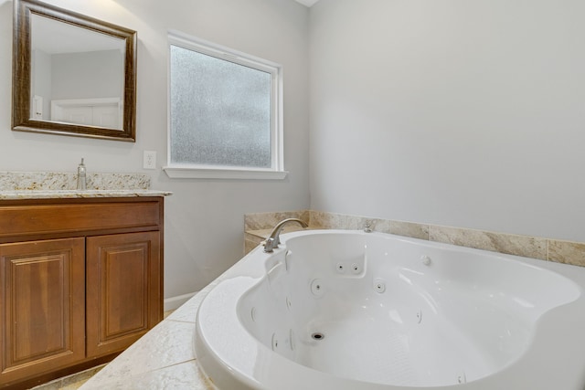 bathroom with vanity and a tub to relax in