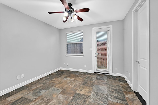 empty room featuring ceiling fan