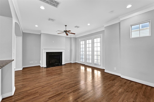 unfurnished living room with ceiling fan, ornamental molding, and dark hardwood / wood-style floors