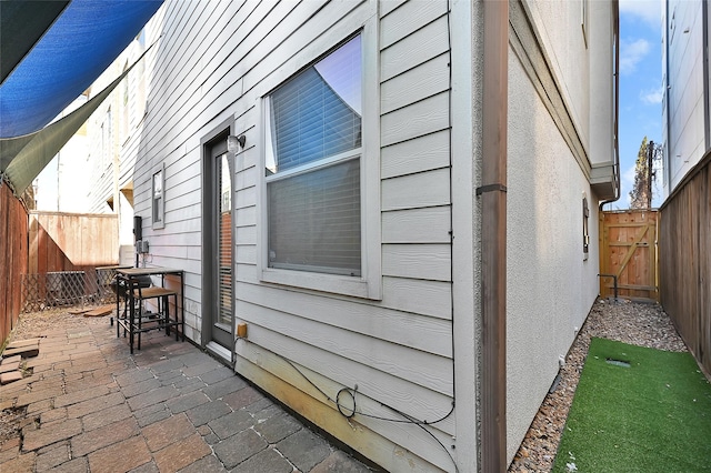 view of side of property featuring a patio area