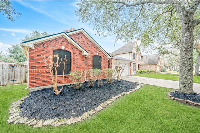 view of front of house featuring a garage and a front yard