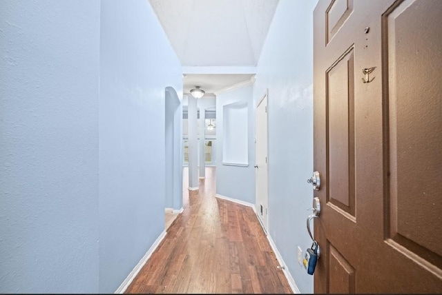 corridor featuring wood-type flooring