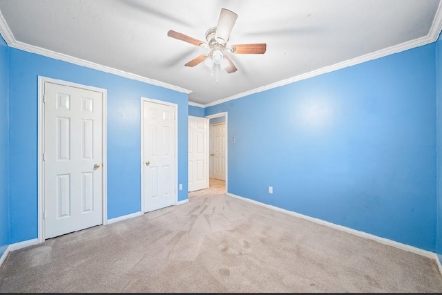 unfurnished bedroom featuring light colored carpet, ornamental molding, and ceiling fan