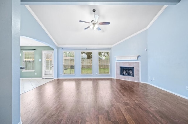 unfurnished living room with crown molding, lofted ceiling, and light hardwood / wood-style floors