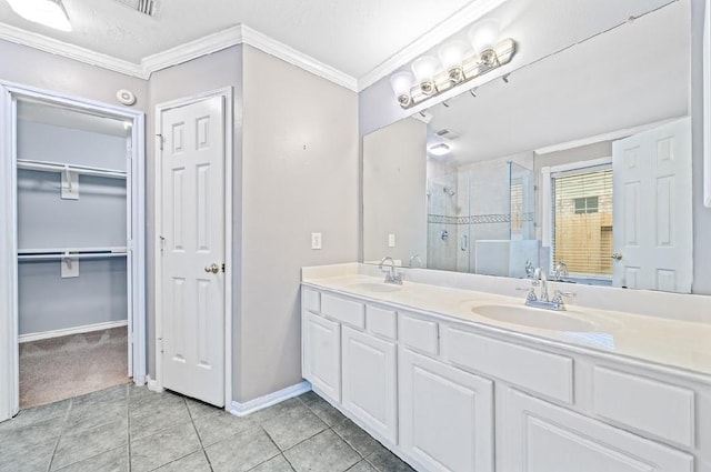 bathroom featuring crown molding, an enclosed shower, tile patterned floors, and vanity