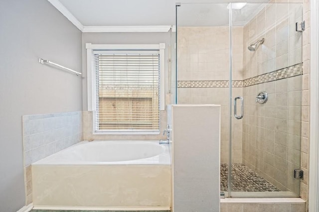 bathroom with crown molding and separate shower and tub