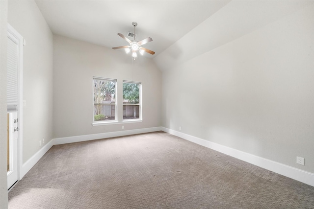 unfurnished room with lofted ceiling, carpet floors, visible vents, a ceiling fan, and baseboards