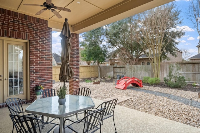 view of patio / terrace featuring ceiling fan, outdoor dining area, and a fenced backyard