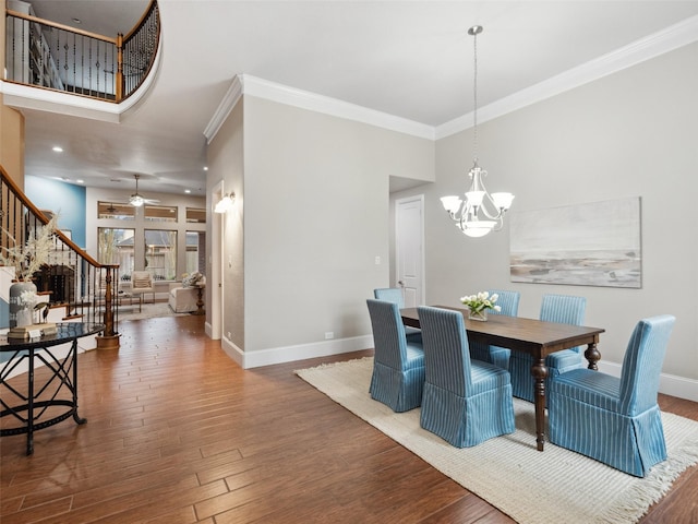 dining area with ornamental molding, stairway, wood finished floors, and baseboards