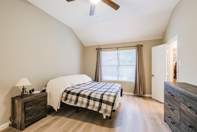 bedroom featuring lofted ceiling, ceiling fan, and light hardwood / wood-style flooring