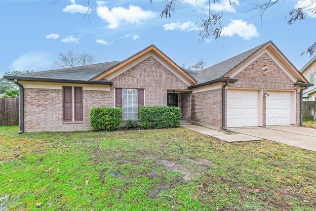 ranch-style home with a garage and a front lawn