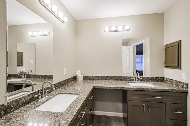 bathroom featuring vanity and hardwood / wood-style flooring