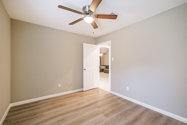 spare room with ceiling fan and light hardwood / wood-style flooring