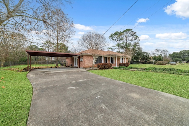 single story home featuring a carport and a front lawn