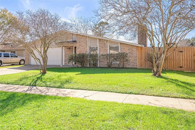 single story home featuring a garage and a front yard