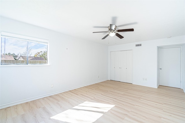 unfurnished bedroom featuring ceiling fan and light hardwood / wood-style floors