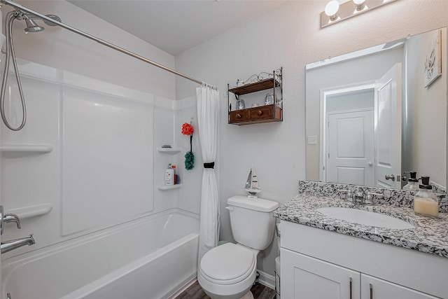 full bathroom with shower / bath combo, vanity, and toilet