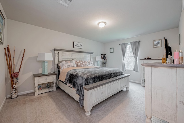 bedroom with light carpet