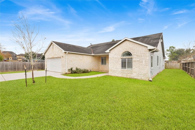 single story home featuring a garage and a front lawn