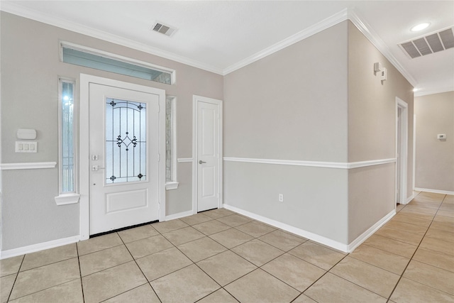 foyer featuring crown molding, a healthy amount of sunlight, and light tile patterned flooring