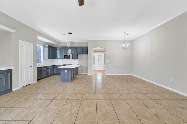 kitchen with a kitchen bar, decorative light fixtures, ornamental molding, a kitchen island, and stainless steel appliances