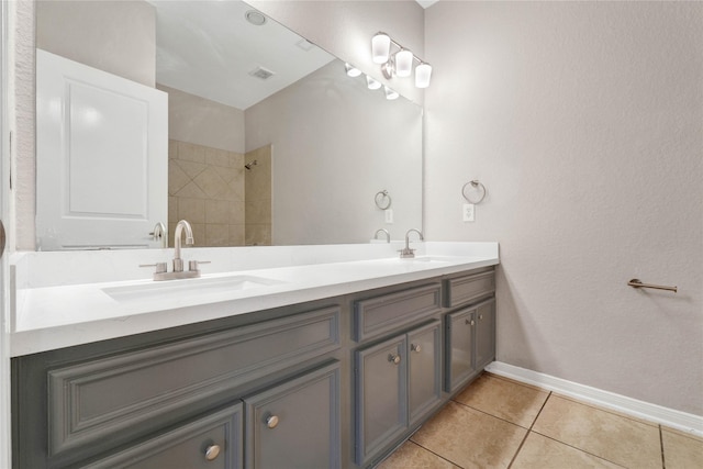 bathroom with tile patterned floors and vanity