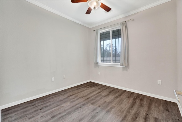 empty room with dark hardwood / wood-style flooring, crown molding, and ceiling fan