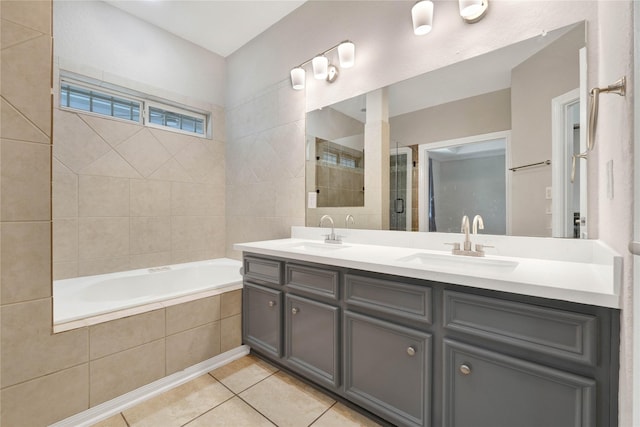 bathroom with tile patterned floors, plus walk in shower, and vanity