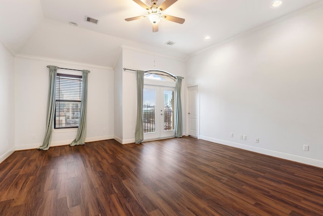 spare room featuring vaulted ceiling, ornamental molding, ceiling fan, dark wood-type flooring, and french doors