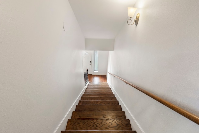 stairway featuring hardwood / wood-style floors